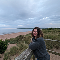 Joy Nicolson looking at beach