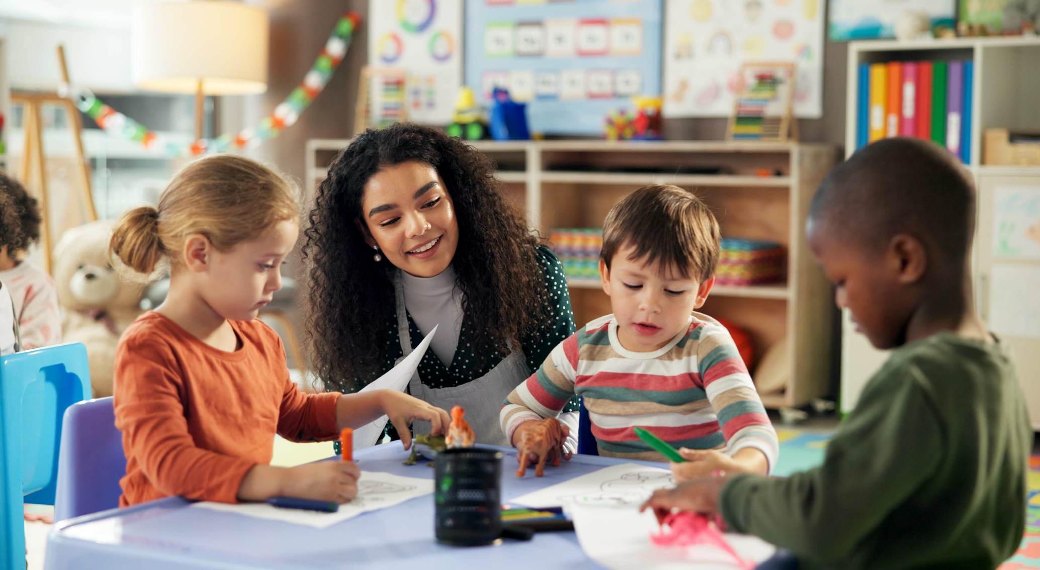 Childcare graduate apprentice working in a nursery Childcare graduate apprentice working in a nursery