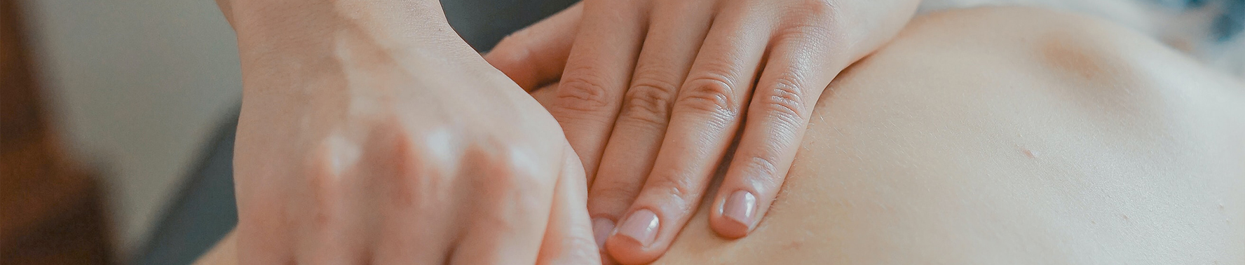 Person giving a back massage