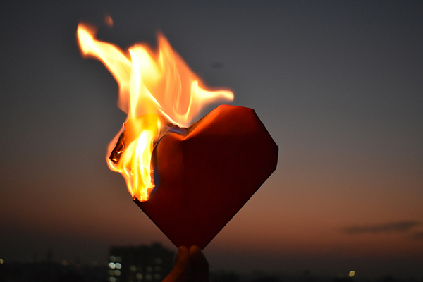 Image of a paper heart and flames