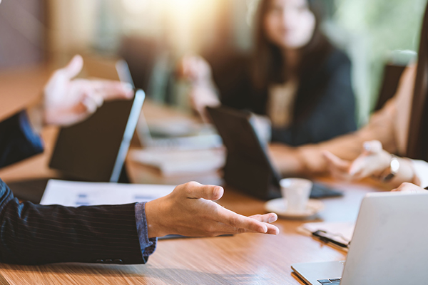 Blurred image of business colleagues in a meeting