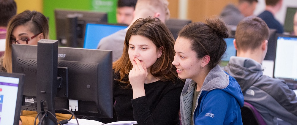 Young students looking at a PC screen