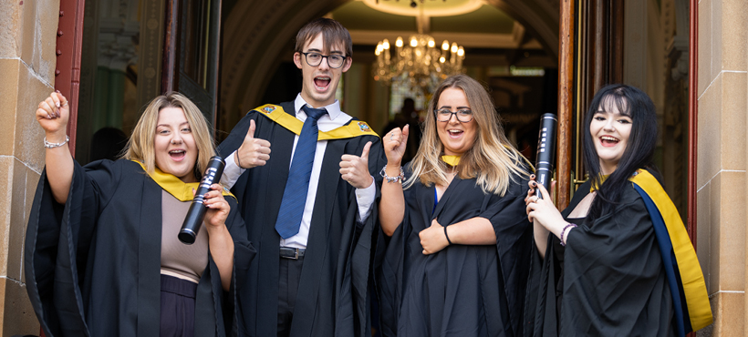 Four UHI Inverness graduates celebrating