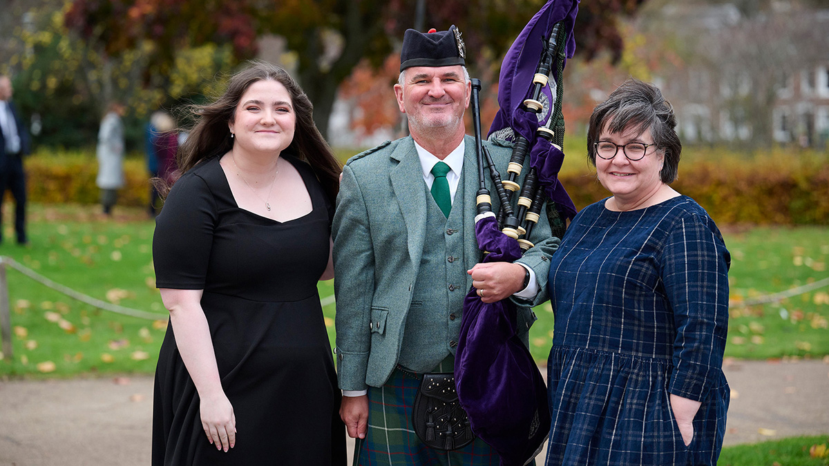Two women standing with a bag piper Two women standing with a bag piper