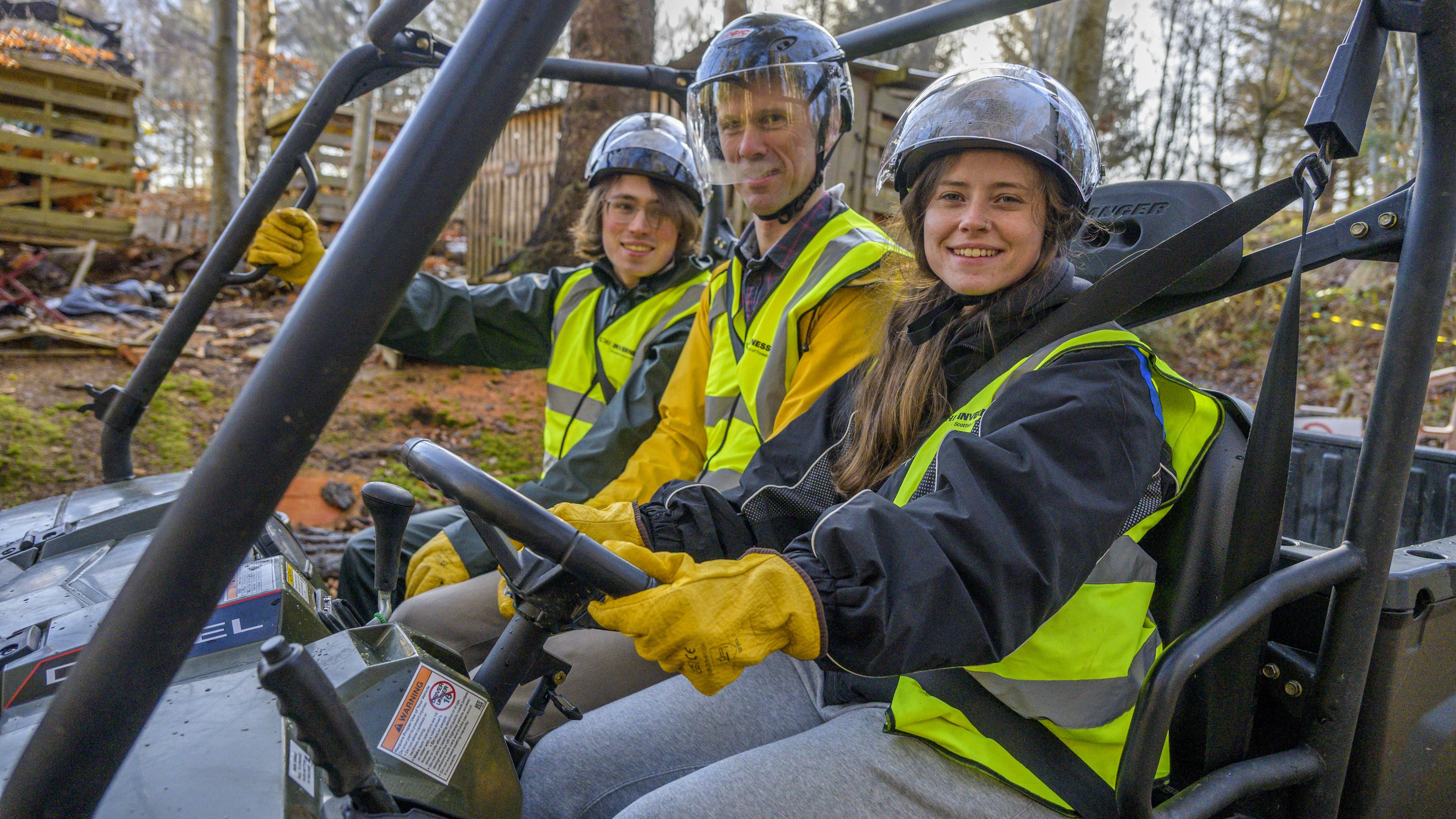 Three students in an ATV