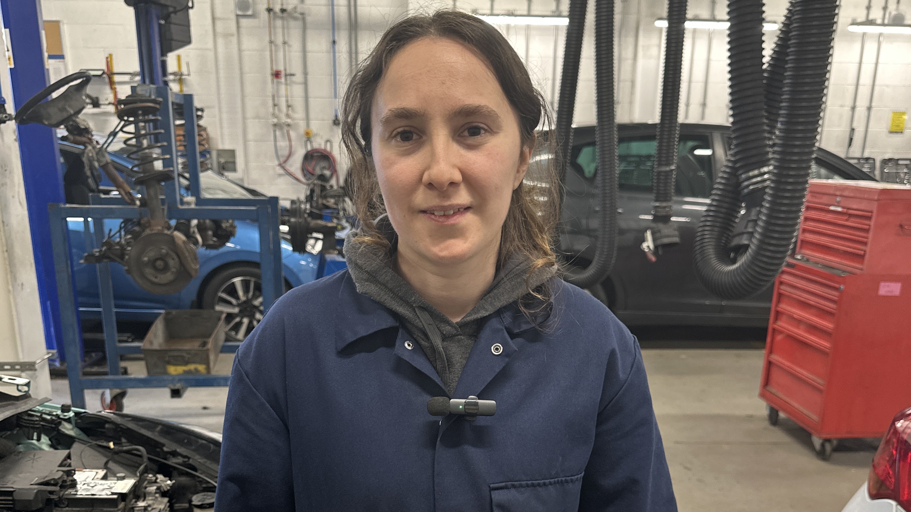 student Katie Sinclair Ferguson standing in a campus workshop