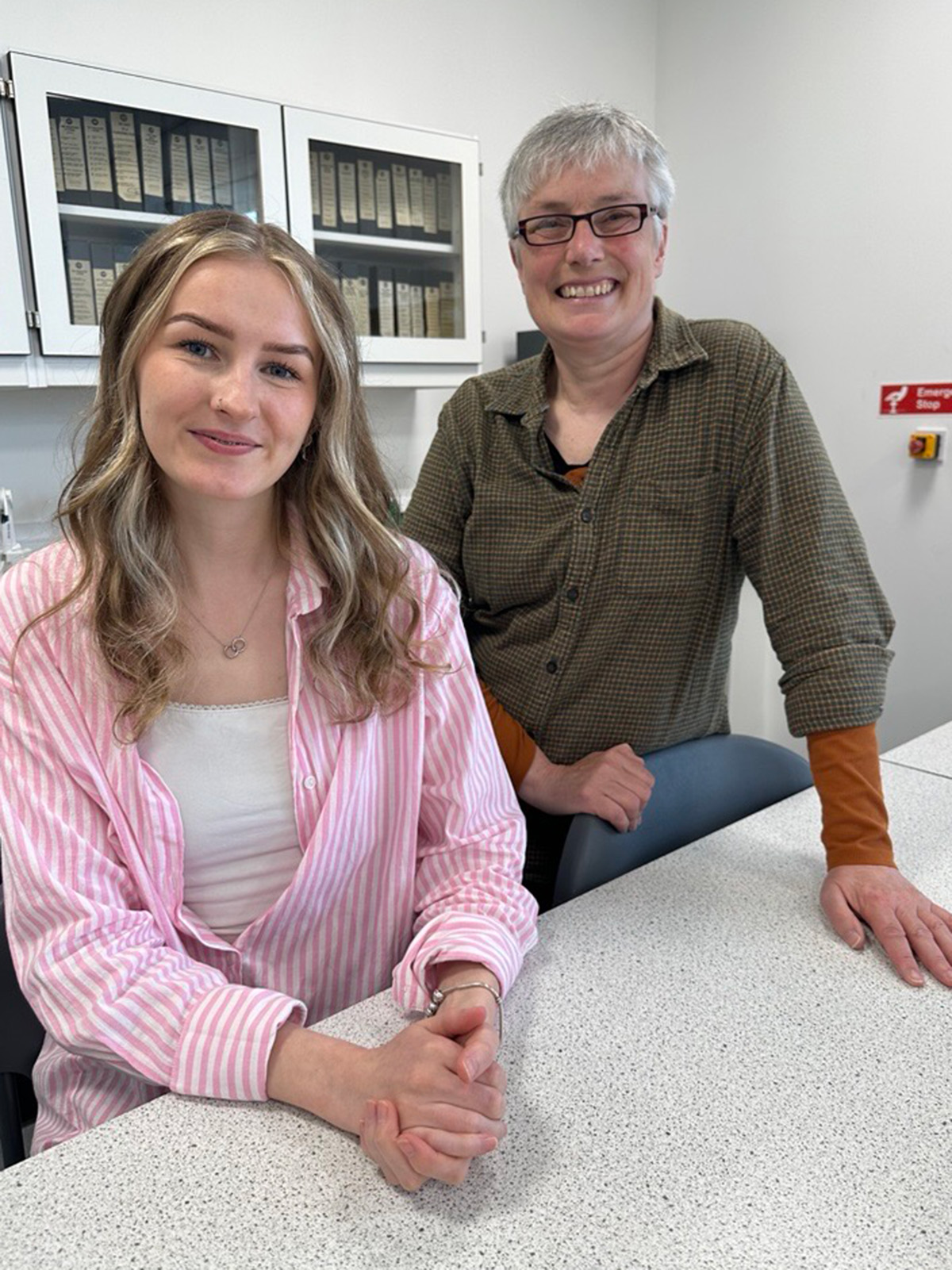 student and lecturer in a lab
