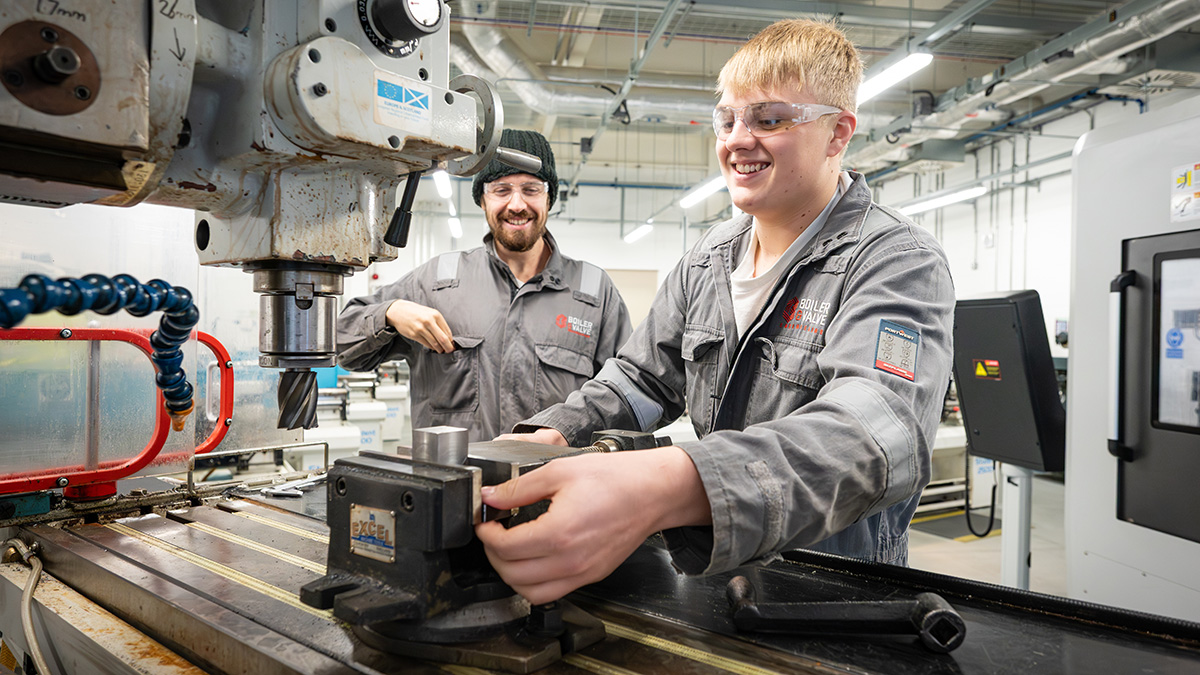 Two apprentices in a workshop