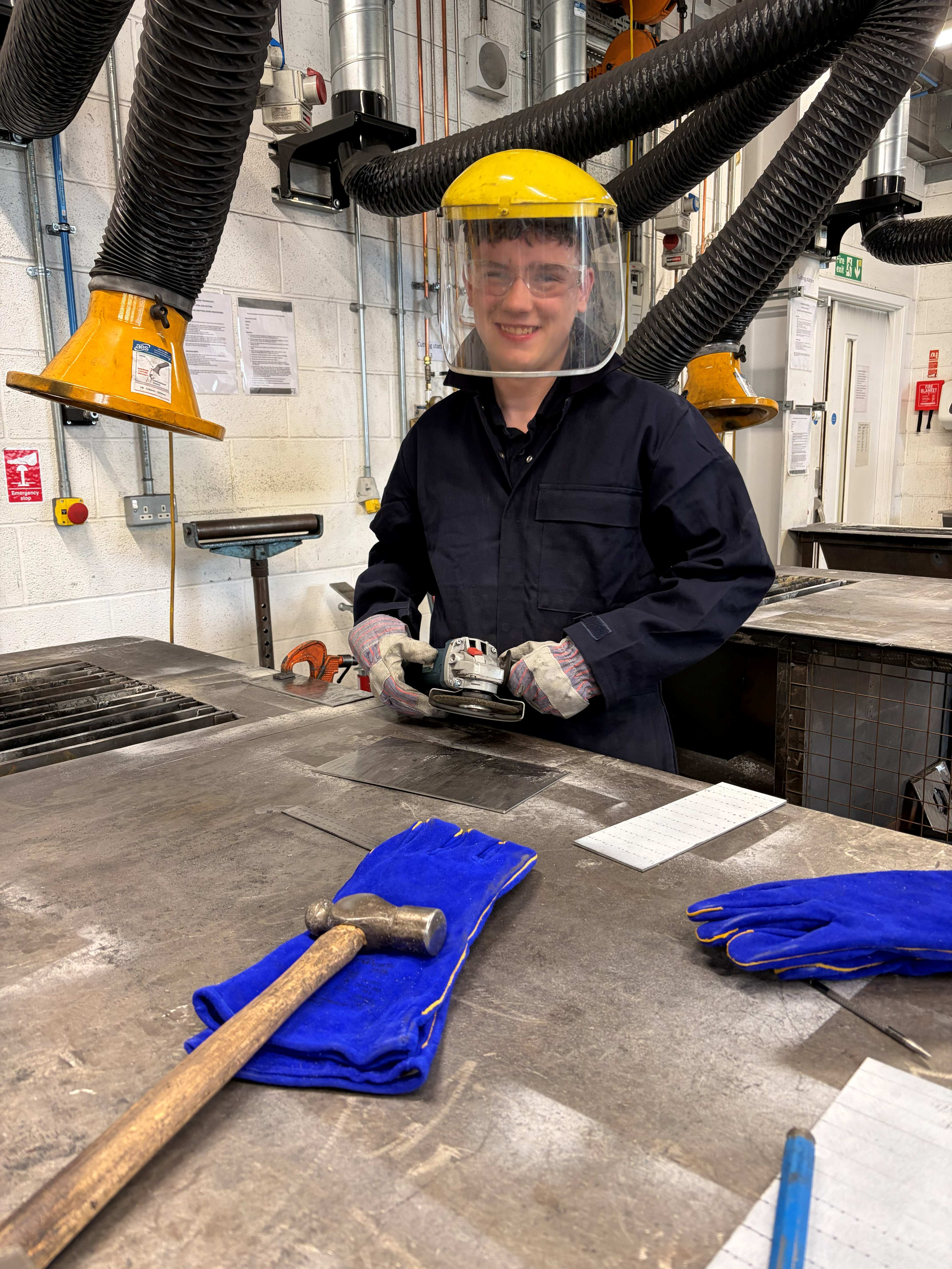 male student in the welding workshop