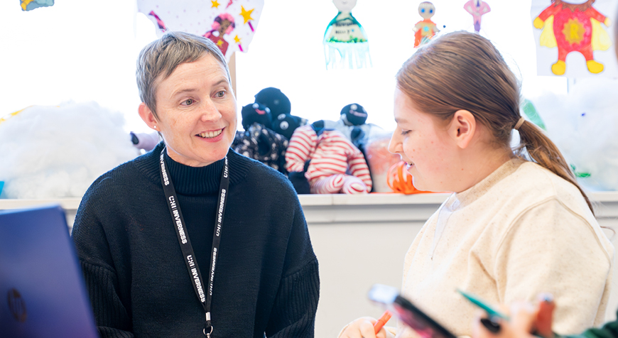 UHI Inverness childcare lecturer and student in classroom UHI Inverness childcare lecturer and student in classroom