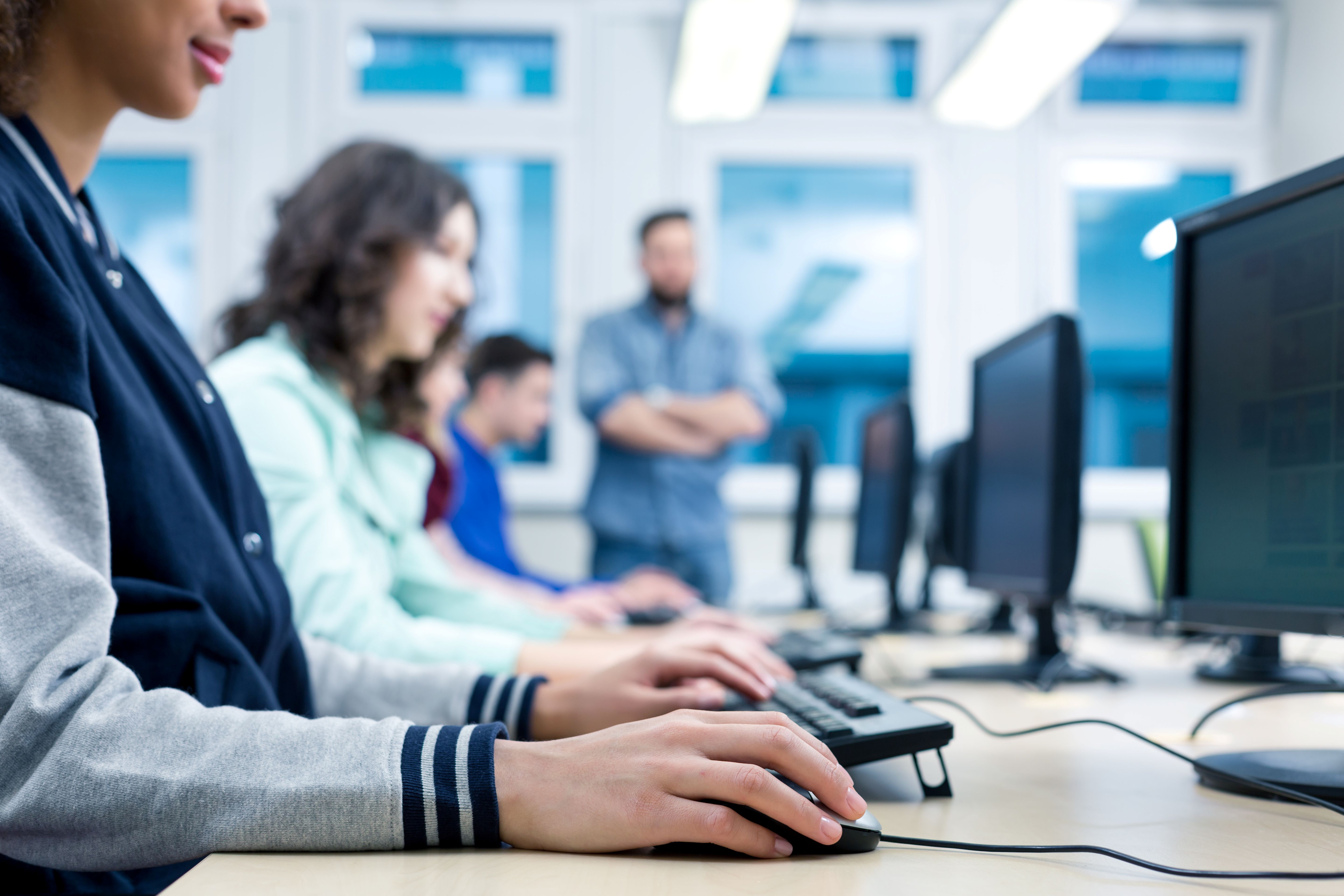 students at a computer students at a computer